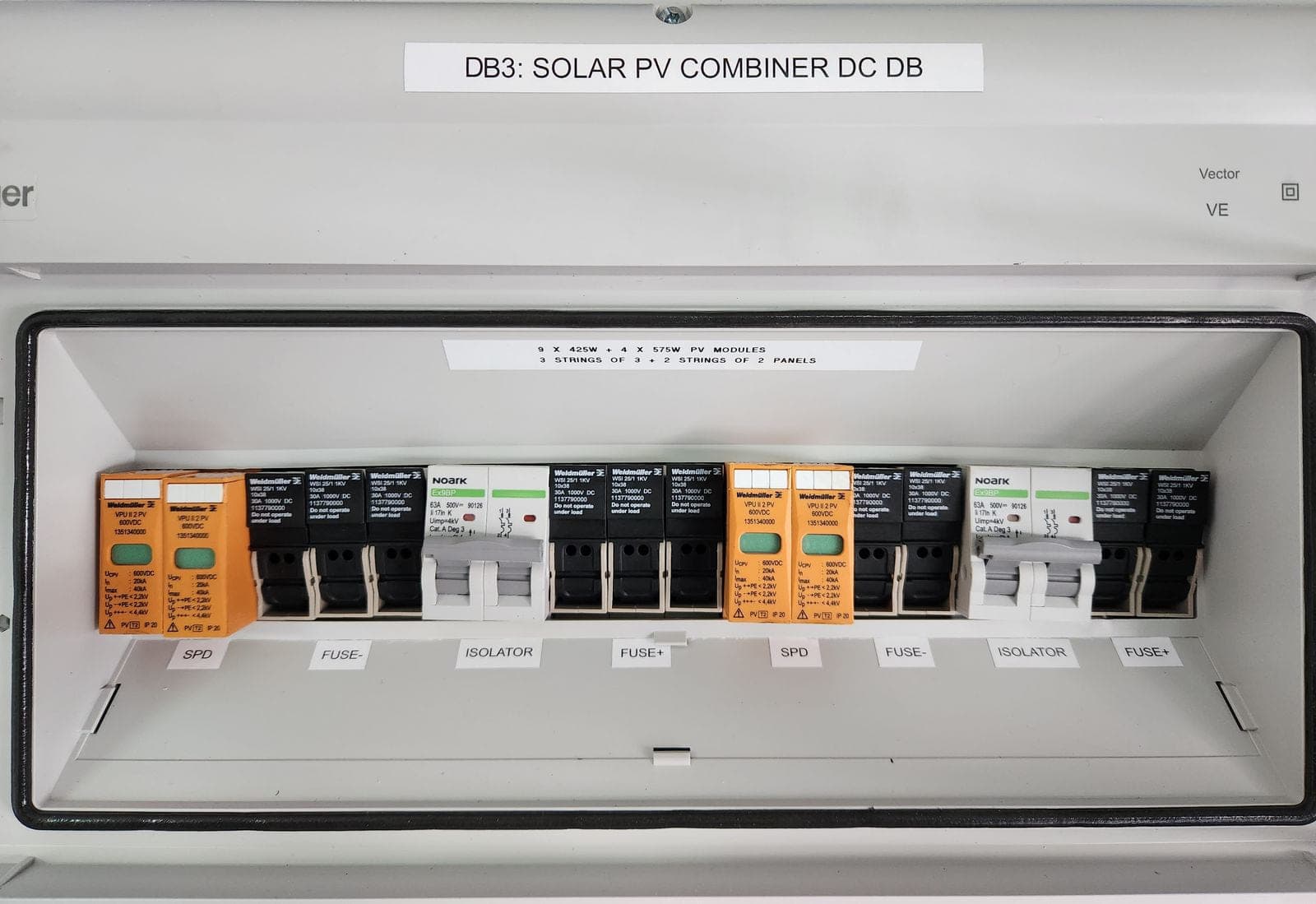 PV combiner enclosure open showing labelled string connections